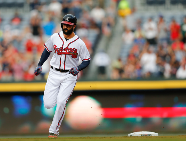 Atlanta Braves' Nick Markakis rounds second base after hitting a two-run home run in the first inning of a baseball game against the Los Angeles Dodgers Monday, July 20, 2015, in Atlanta. (AP Photo/John Bazemore)