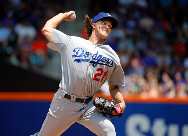 Los Angeles Dodgers starting pitcher Zack Greinke delivers in the first inning of a baseball game against the New York Mets in New York, Sunday, July 26, 2015. (AP Photo/Kathy Willens)